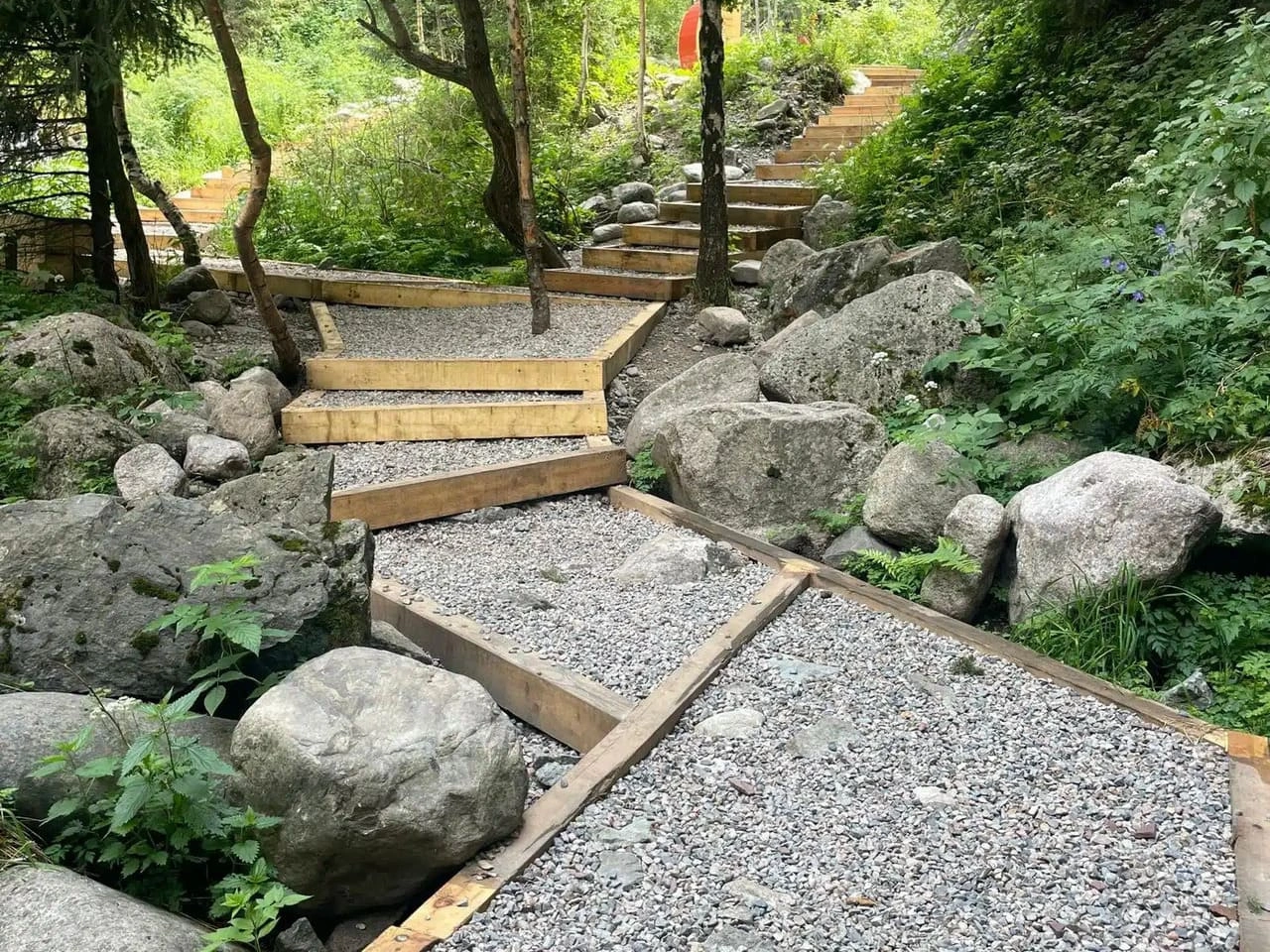 Wooden trail and stone path leading to Alma Arasan hot springs near Almaty