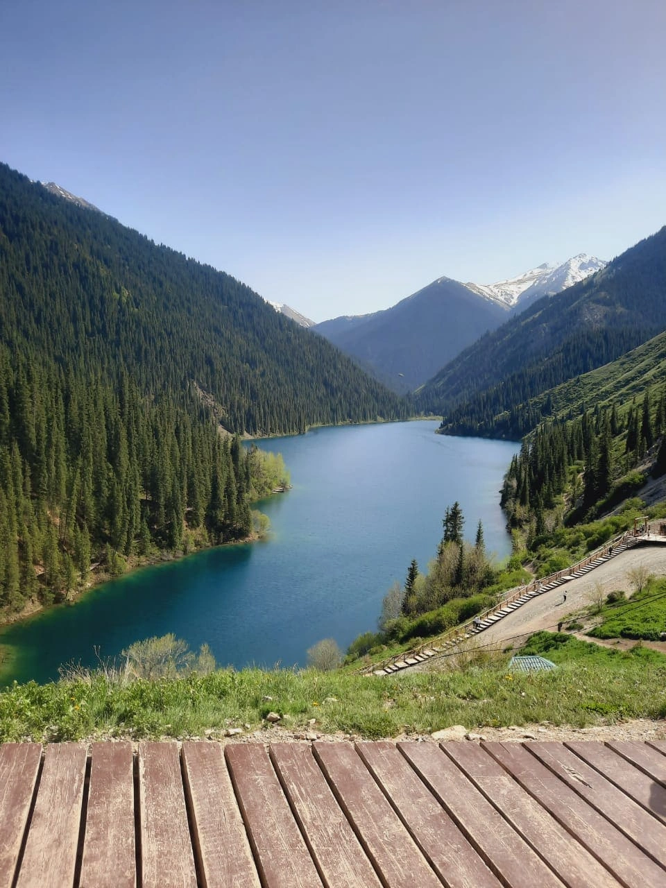 Panoramic view of Kolsai Lake from the wooden viewpoint deck