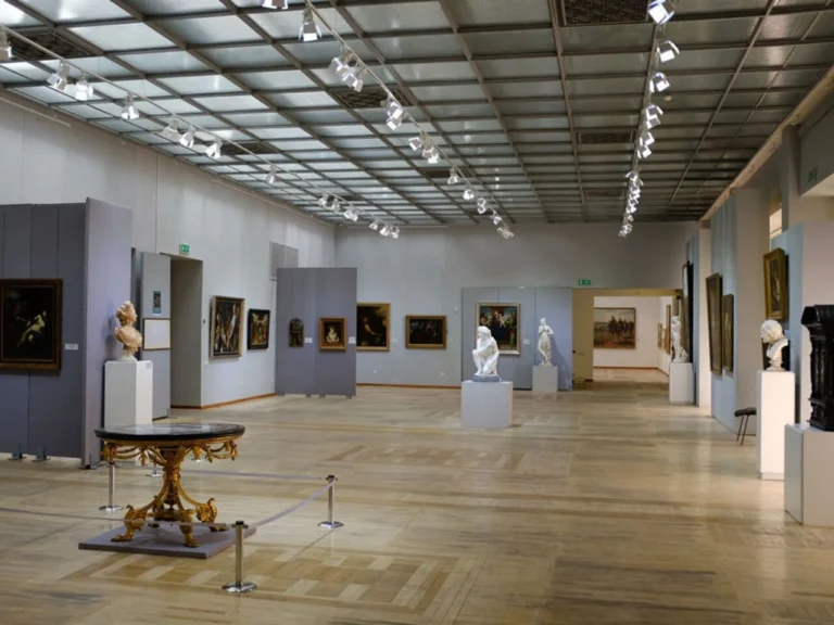 Art exhibition hall inside the Central State Museum of Kazakhstan with sculptures and classical paintings