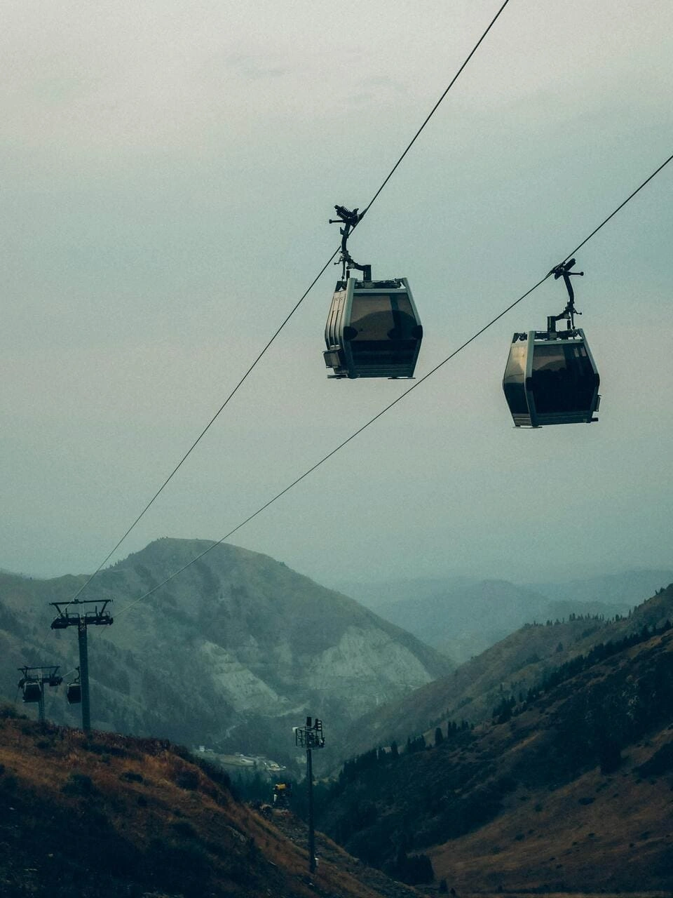 Gondola cable cars at Shymbulak ski resort above the mountain valley