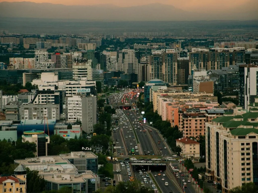 Tourists exploring Almaty city center during a guided city tour in Kazakhstan.