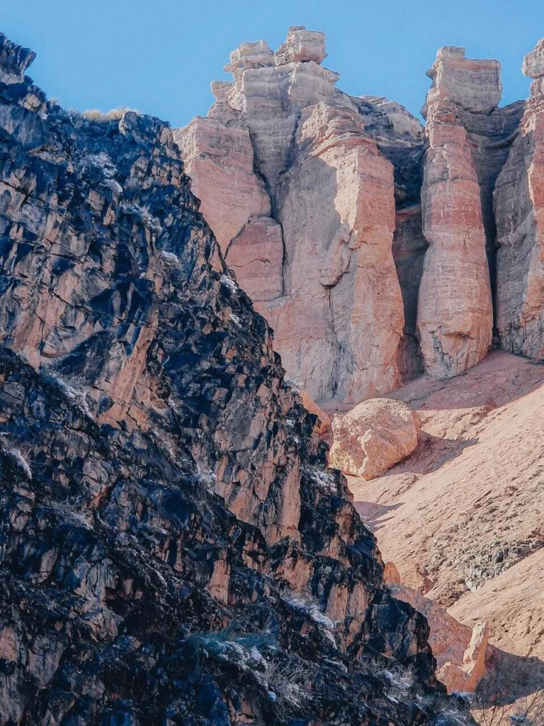 Hiking trail through dramatic rock formations in Black Canyon Kazakhstan