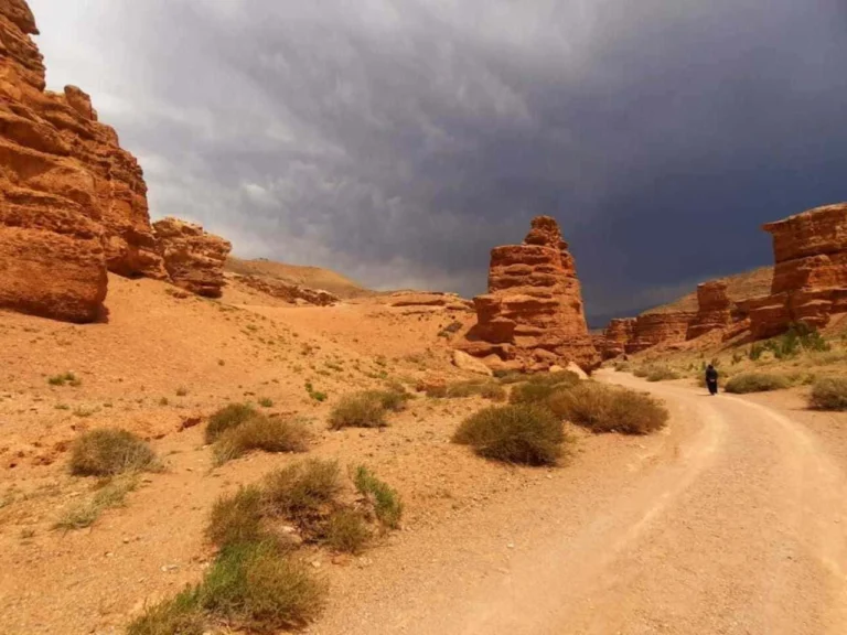 Couple hiking along the rocky trails of Charyn Canyon National Park in southern Kazakhstan.