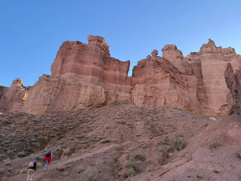 Adventure travelers exploring the Valley of Castles during a one-day Charyn Canyon tour.