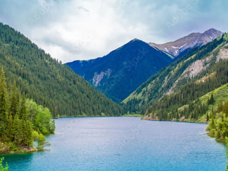 kolsay lake surrounded by green mountains in kazakhstan